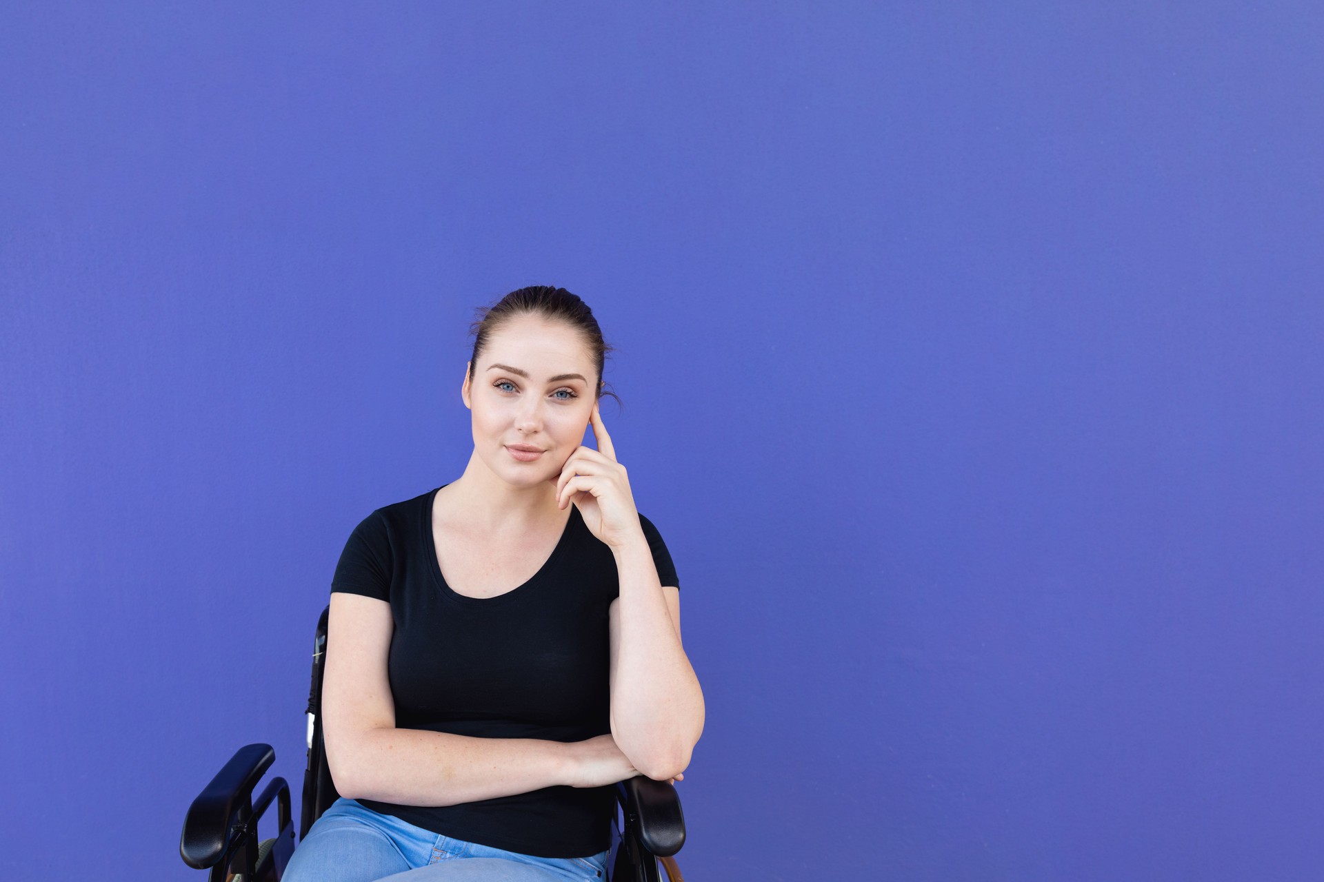 Confident Young Disabled Woman In Wheelchair